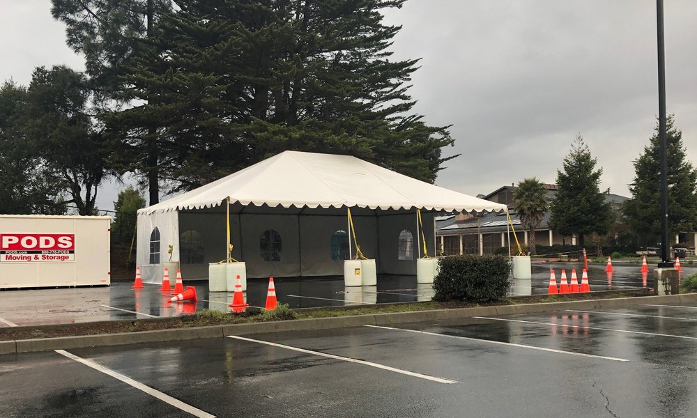 White party tent rental set up outdoors