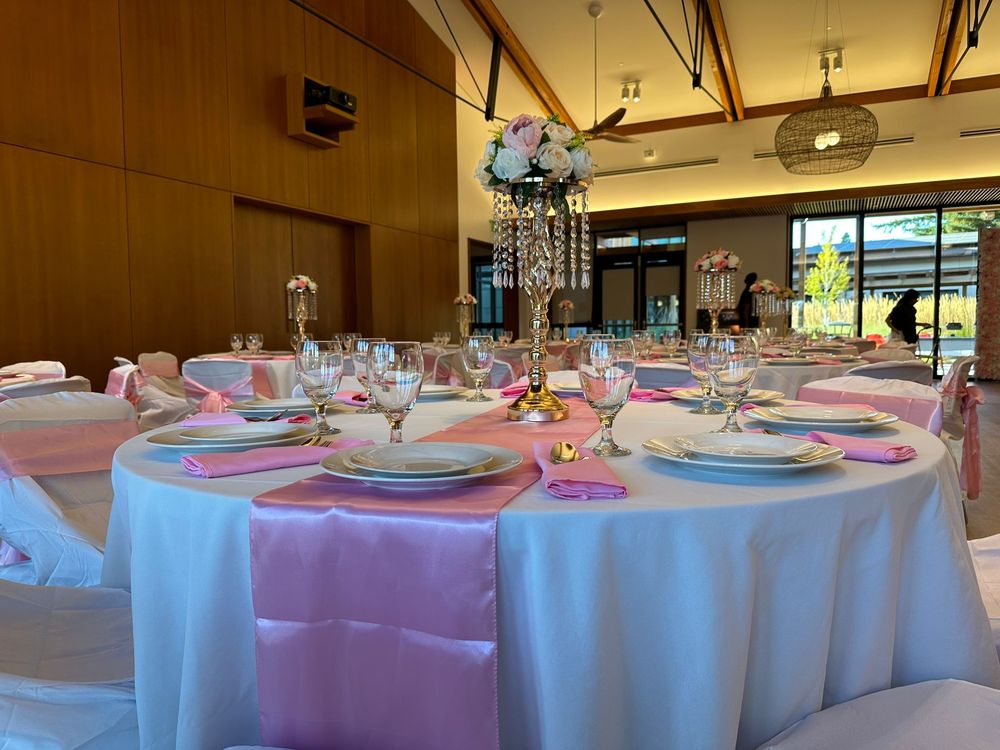 Reception tables set with linens in an event hall